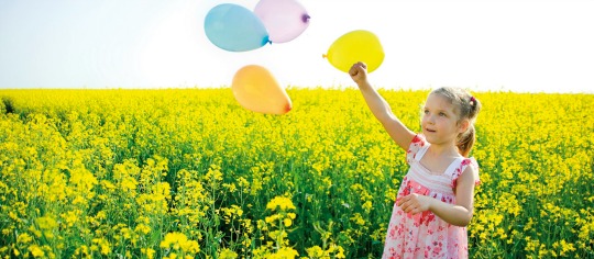 Girl with Balloons on a yellow field